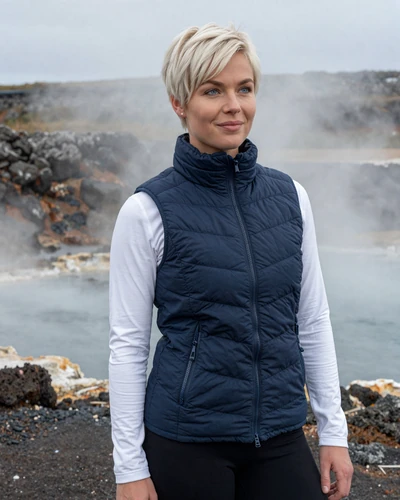 Icelandic woman Aslaug near a geothermal area in Reykjanesbaer with volcanic steam rising