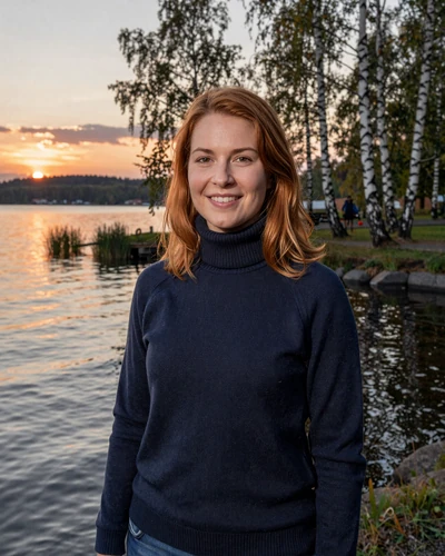 Swedish woman Nora by Lake Mälaren near Västerås at sunset with birch trees