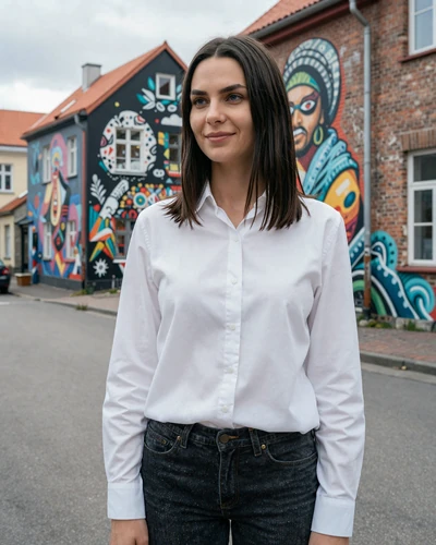 Estonian woman Triin in Telliskivi Creative City district Tallinn with urban art murals