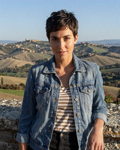 San Marinese woman Martina leaning against a stone wall overlooking Italian countryside