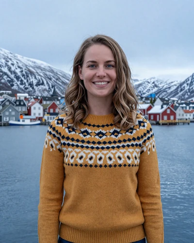 Norwegian woman Maja in Tromsø harbor with Arctic mountains in the background