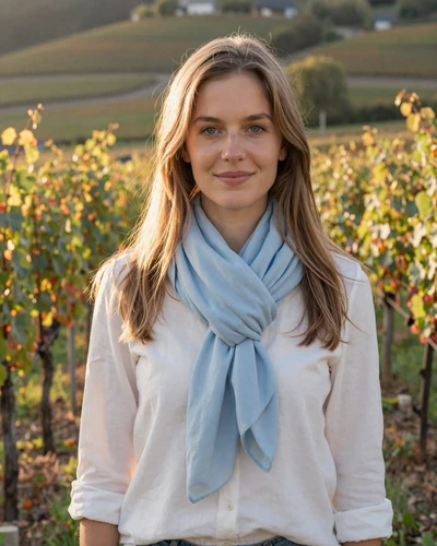 Luxembourg woman Lina among vineyard rows in the Moselle Valley at sunset