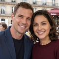 James and Sophie smiling together at a Paris cafe