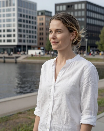 Swedish woman Elin at Malmö waterfront with modern Scandinavian architecture
