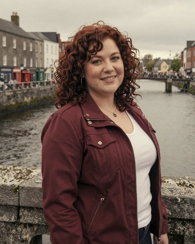 Irish woman Roisin on a stone bridge over the River Shannon in Limerick