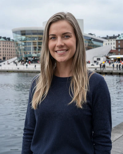 Norwegian woman Astrid smiling near the Oslo Opera House waterfront in Norway