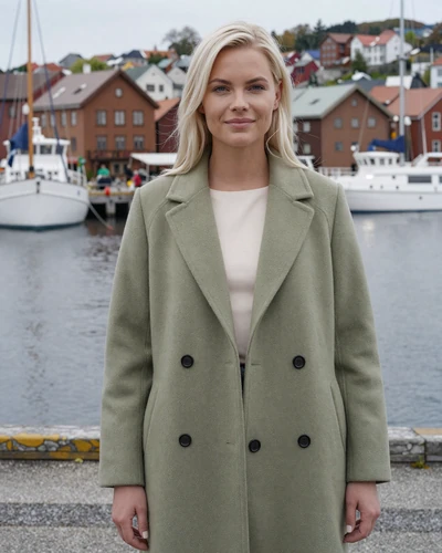 Swedish woman Astrid by Gothenburg harbor in a sage green wool coat
