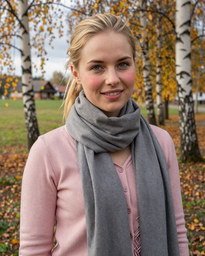 Lithuanian woman Austeja in the Lithuanian countryside with autumn birch trees