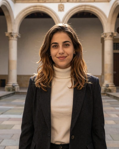 Portuguese woman Sofia in the historic University of Coimbra courtyard