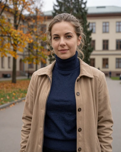 Estonian woman Kati on the University of Tartu campus surrounded by autumn foliage