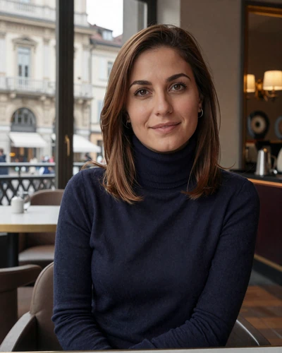 Italian woman Sofia at an elegant cafe in Turin with Baroque architecture