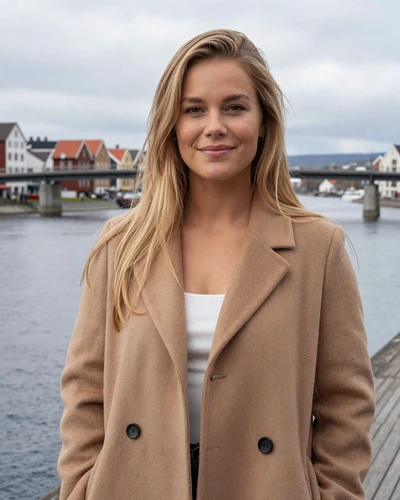 Norwegian woman Nora by the Drammen river with bridge in the background