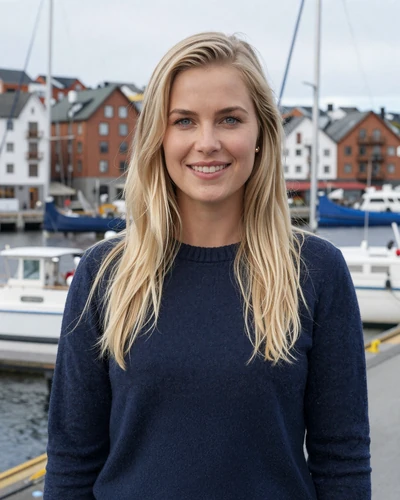 Norwegian woman Astrid smiling at the Oslo harbor waterfront