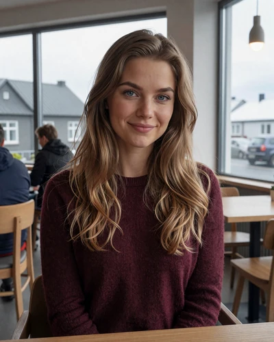 Icelandic woman Helga at a modern cafe in Kopavogur with Icelandic rooftops visible